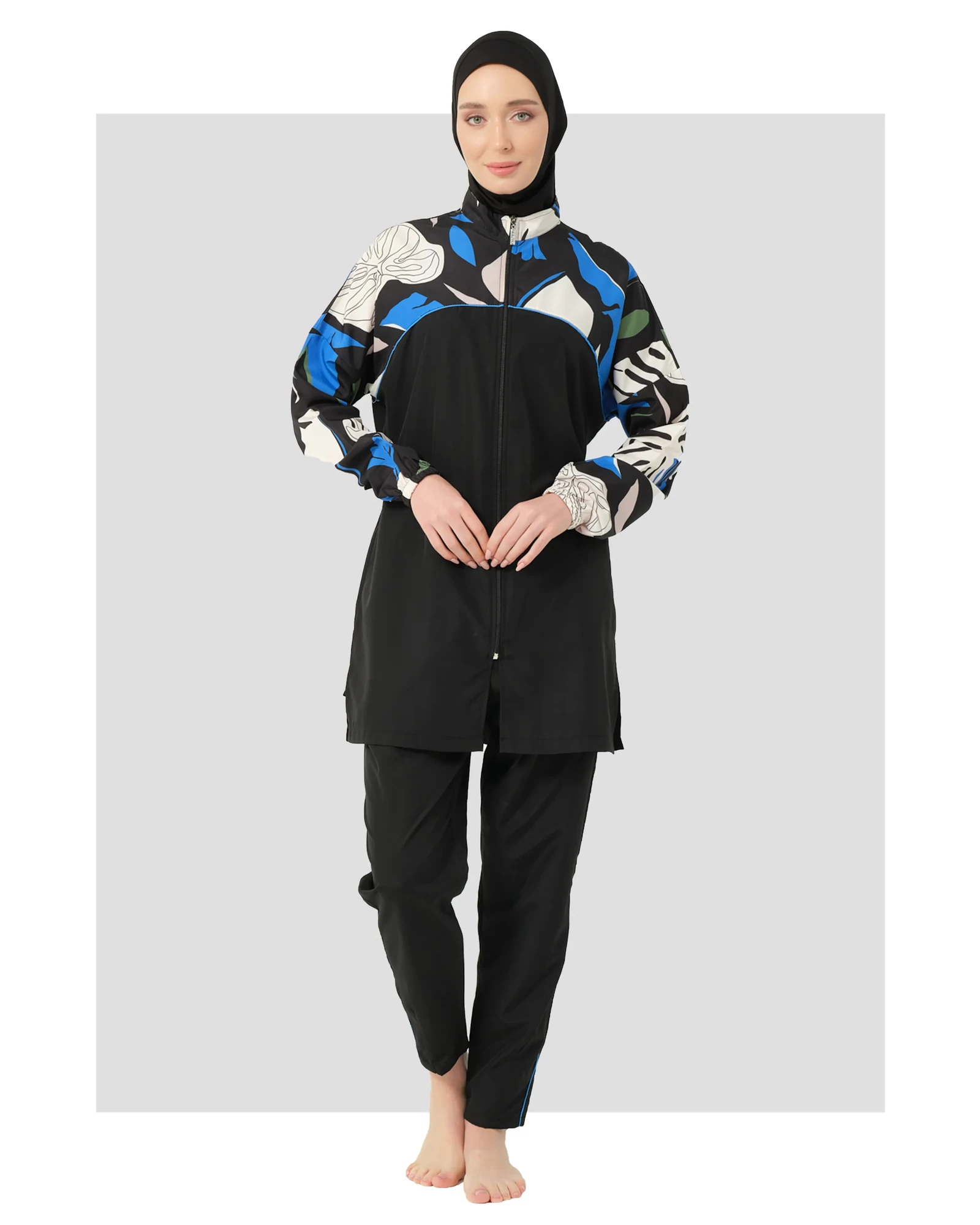 Black hijab swimwear with abstract print on sleeves, front view.