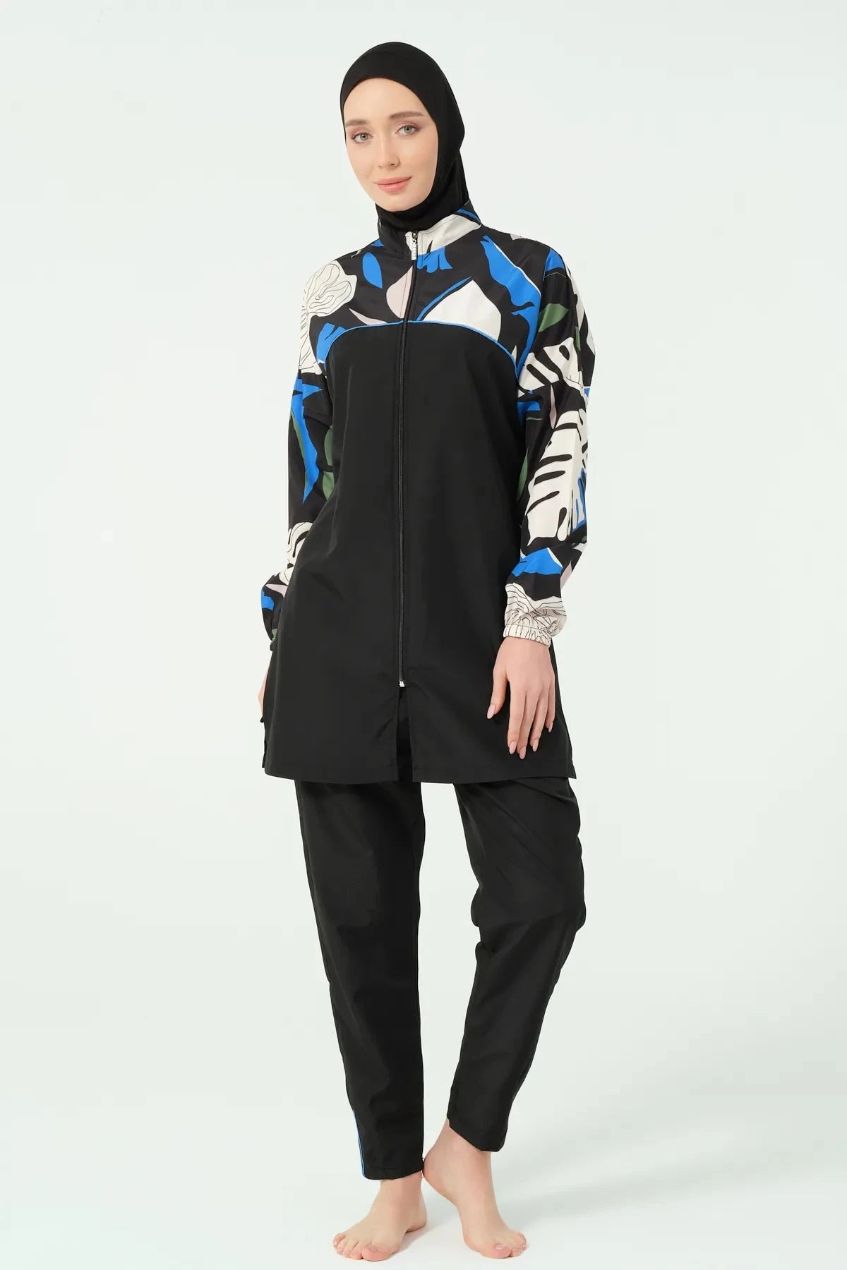 Black modest burkini with abstract print and full-zip closure, front.
