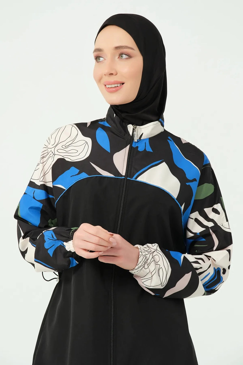 Close-up of hijab swimwear top with abstract print and full-zip.