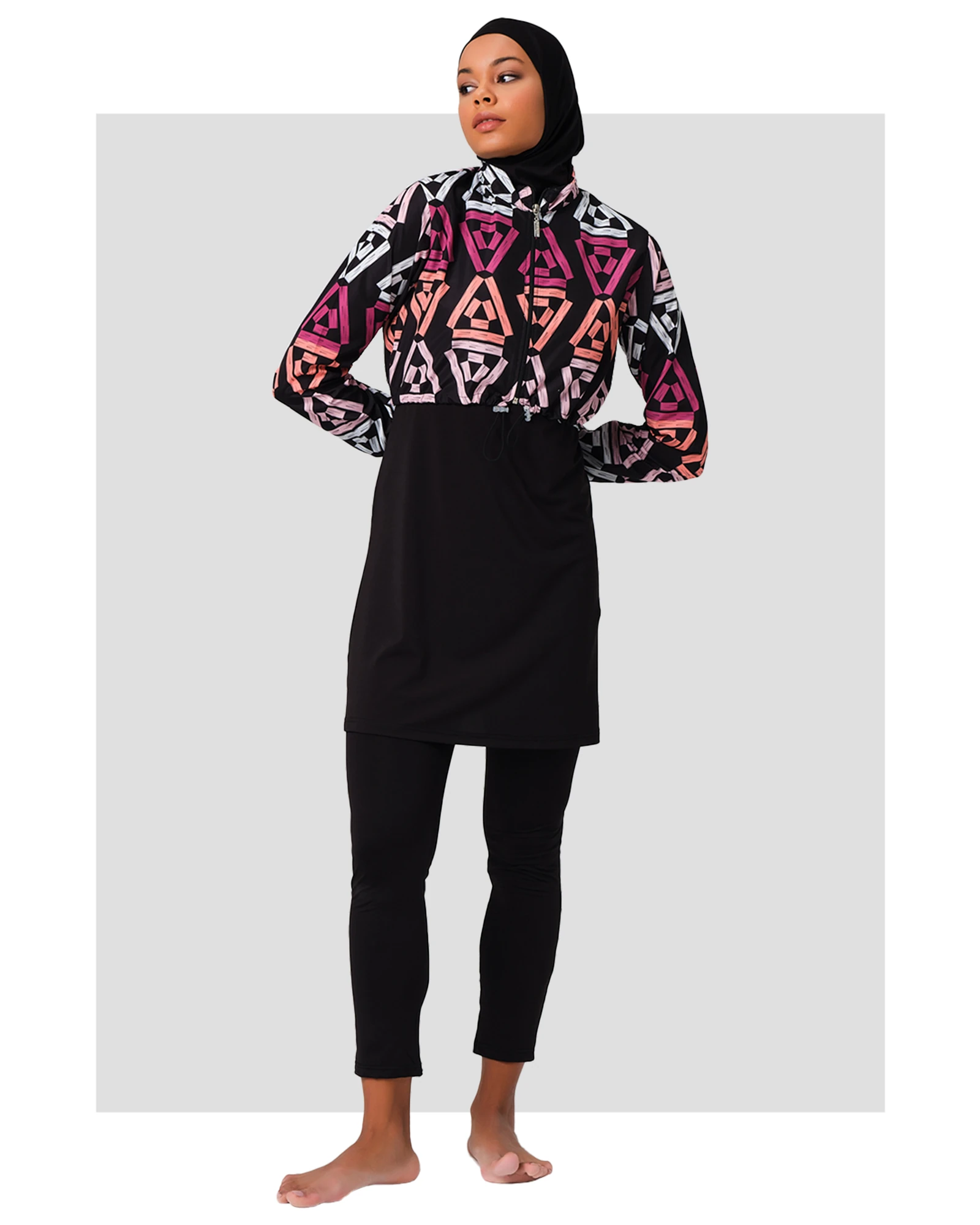 Woman in geometric print modest swimsuit set, front view, black hijab.