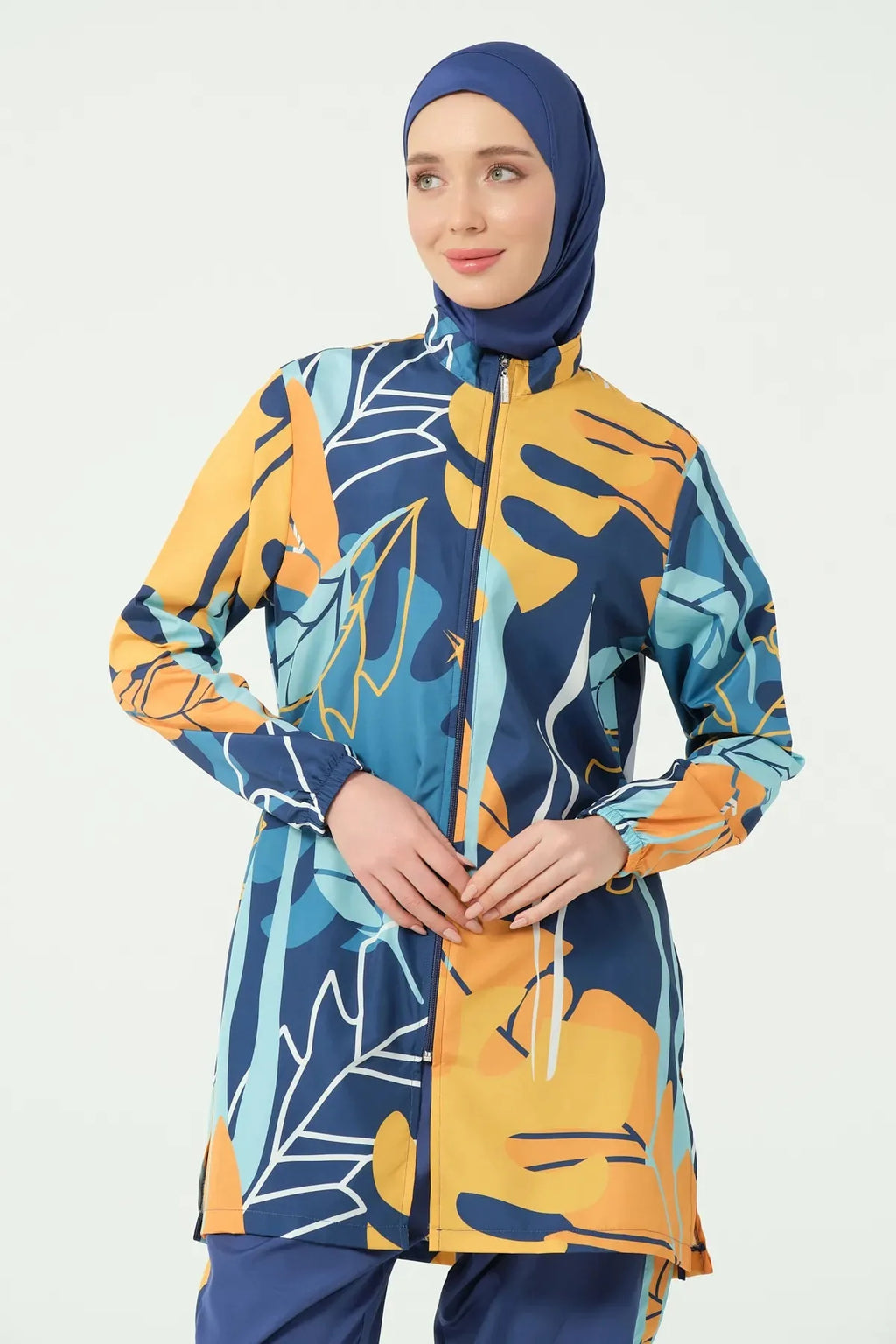 Close-up of abstract print modest swimsuit tunic and hijab.