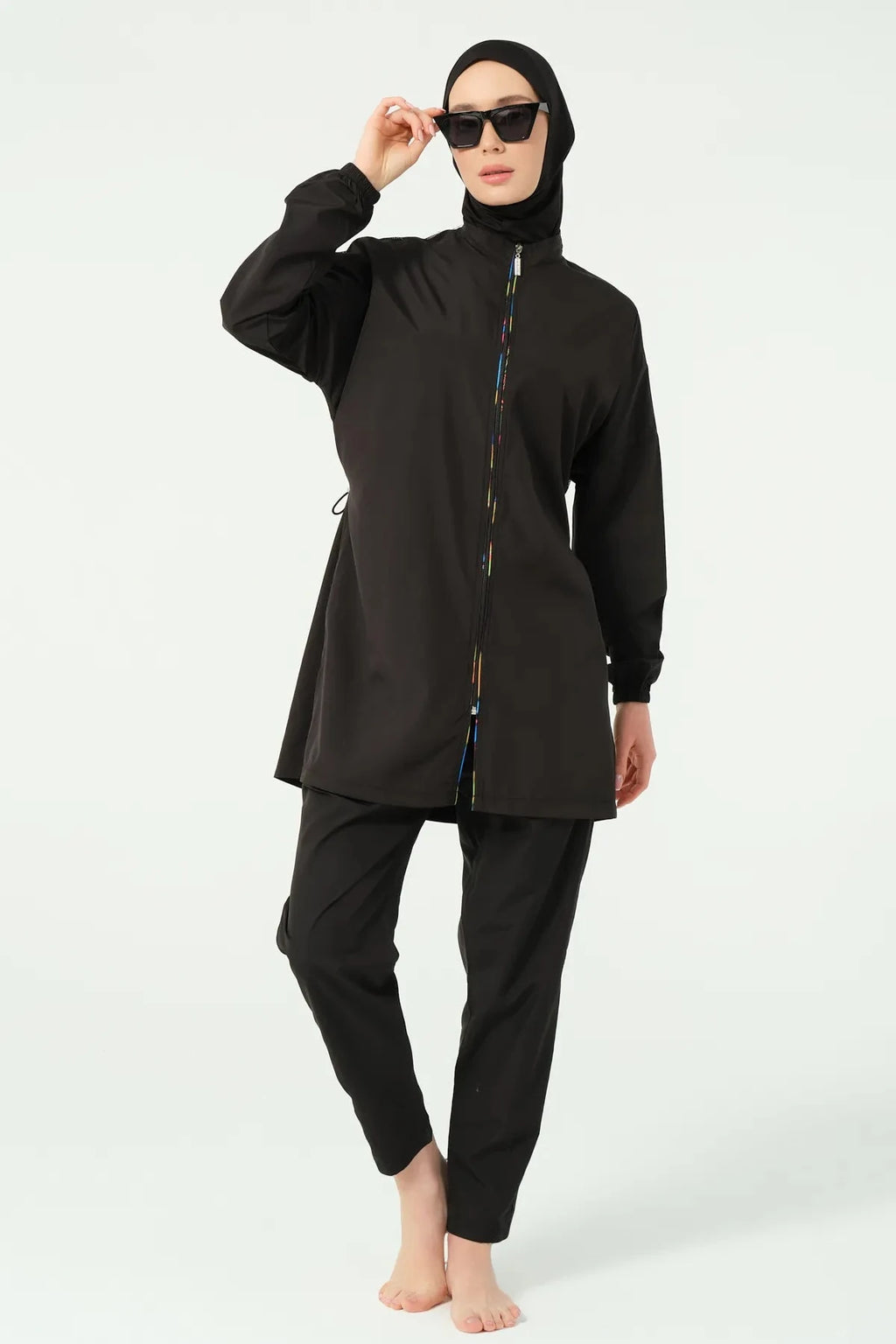 Black modest swimwear front view with hijab and sunglasses.