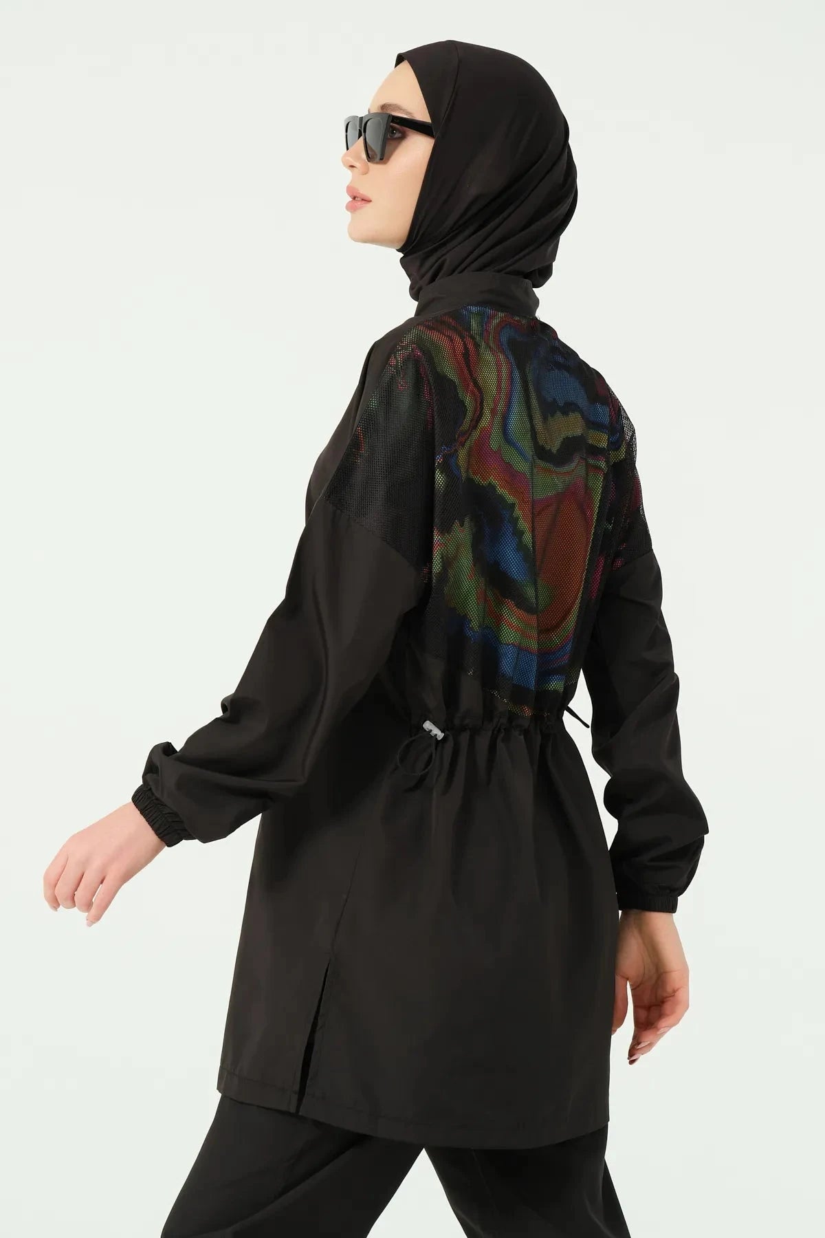 Black modest swimwear back detail with colorful print and hijab.