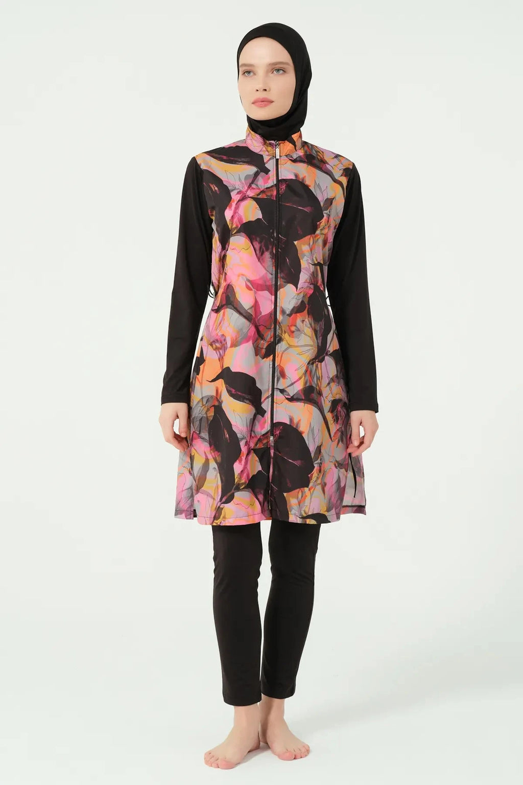 Abstract print burkini top with black sleeves and swim pants, front view.
