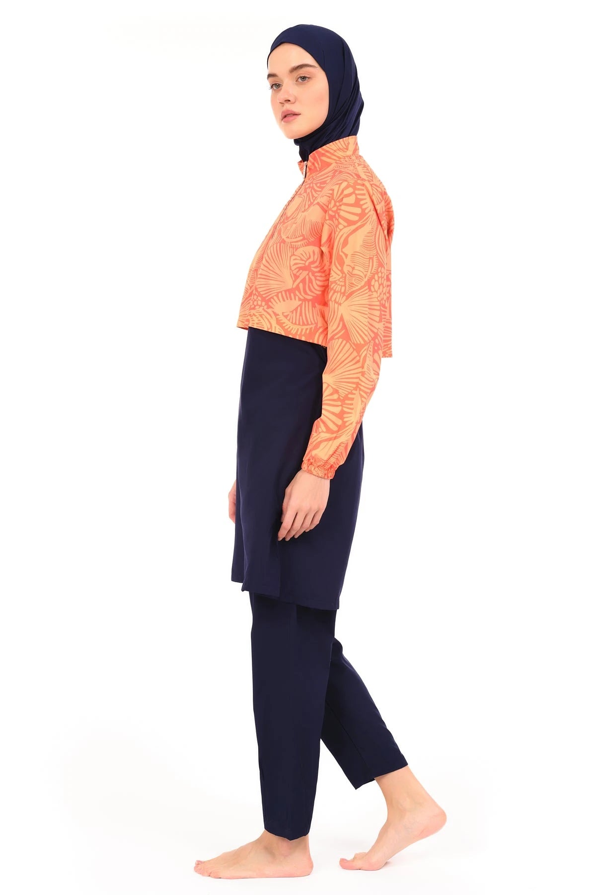Model wearing sunburst active burkini set side profile.
