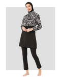 Woman in monochrome hijab swimwear set with abstract print jacket, front angle.