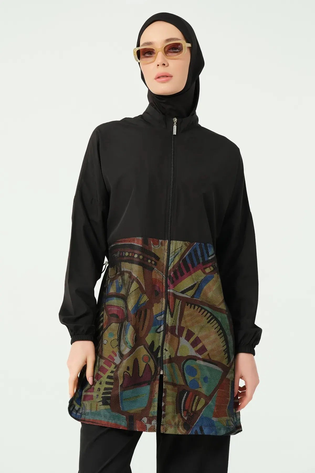 Black burkini set with geometric print top, front view wearing sunglasses.