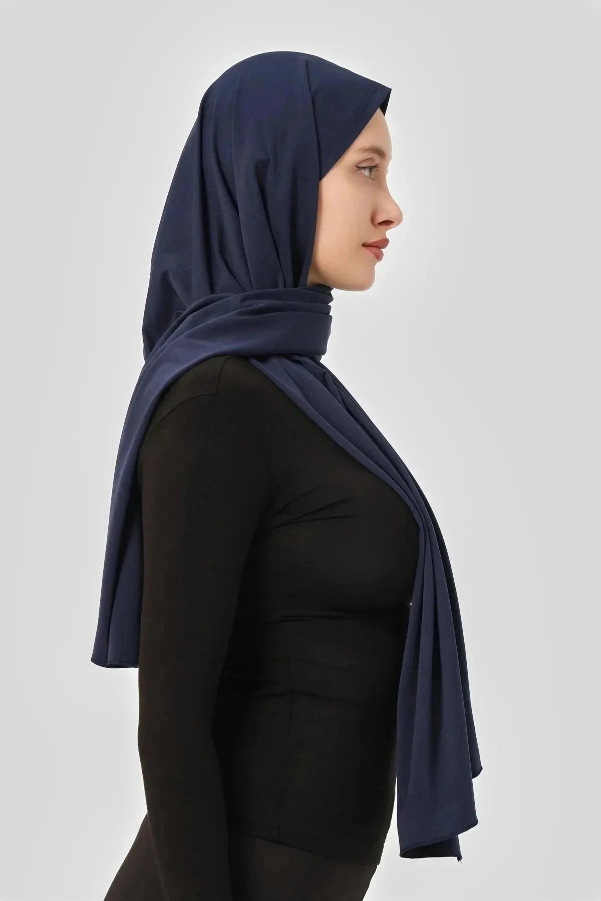 Close-up of the navy blue swim hijab showing fabric drape and fit.