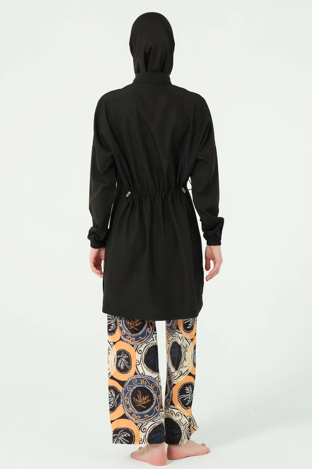 Black hijab swimwear set with patterned wide-leg pants, back view.