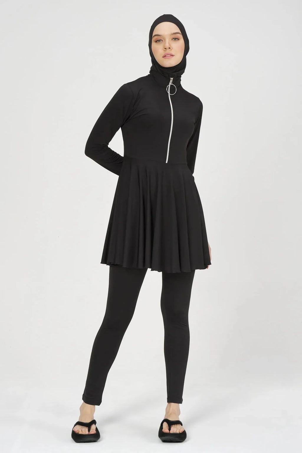 Black flared modest swimsuit set front view on model with hands on hips