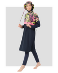 Woman in navy tropical print burkini set with matching bucket hat.