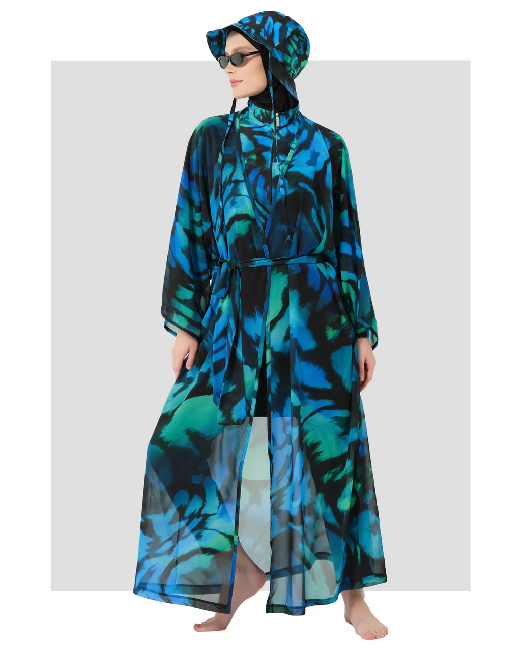 Model in full burkini set with sheer kimono and bucket hat, front view.