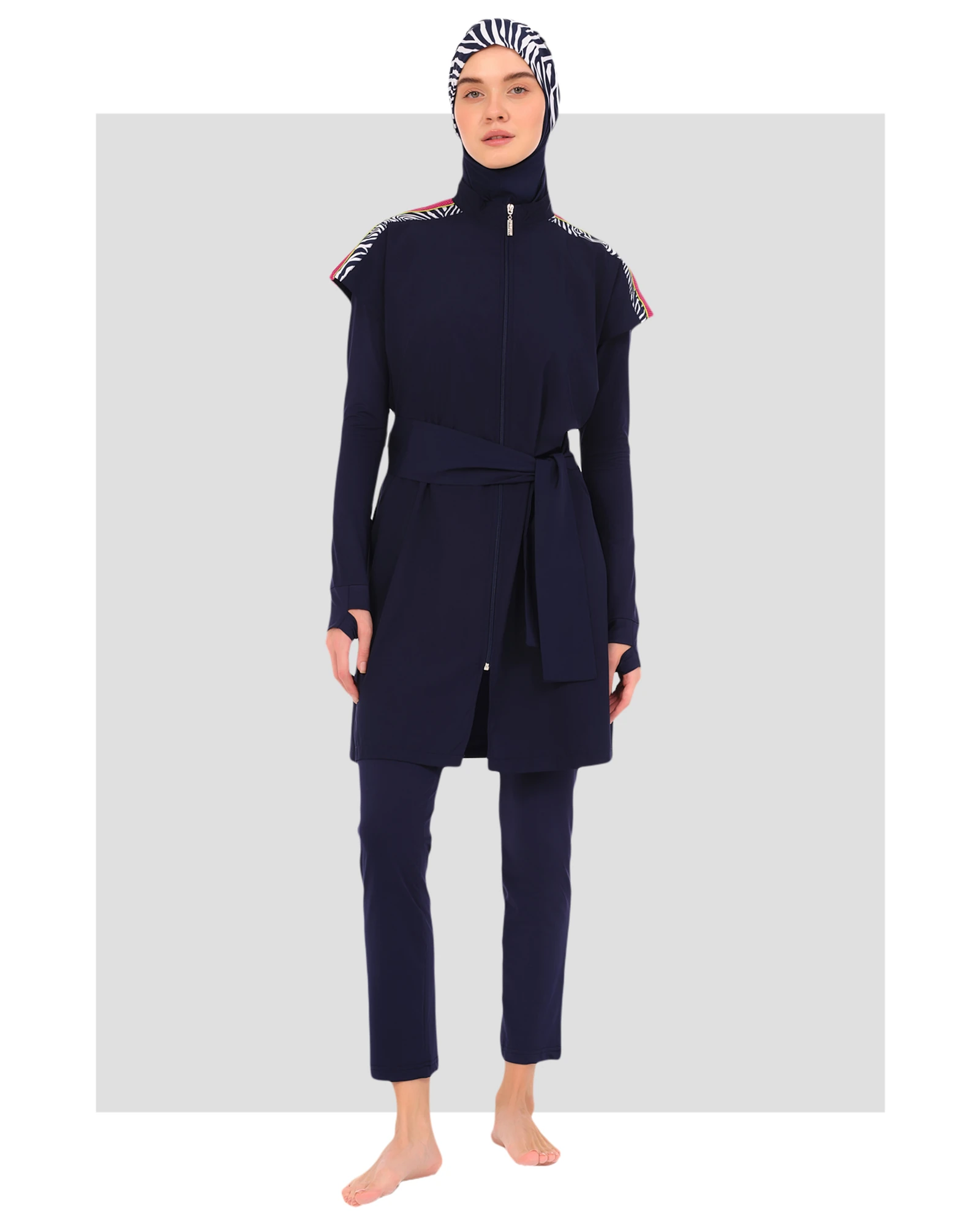 Model wearing navy burkini set with zebra print hijab.
