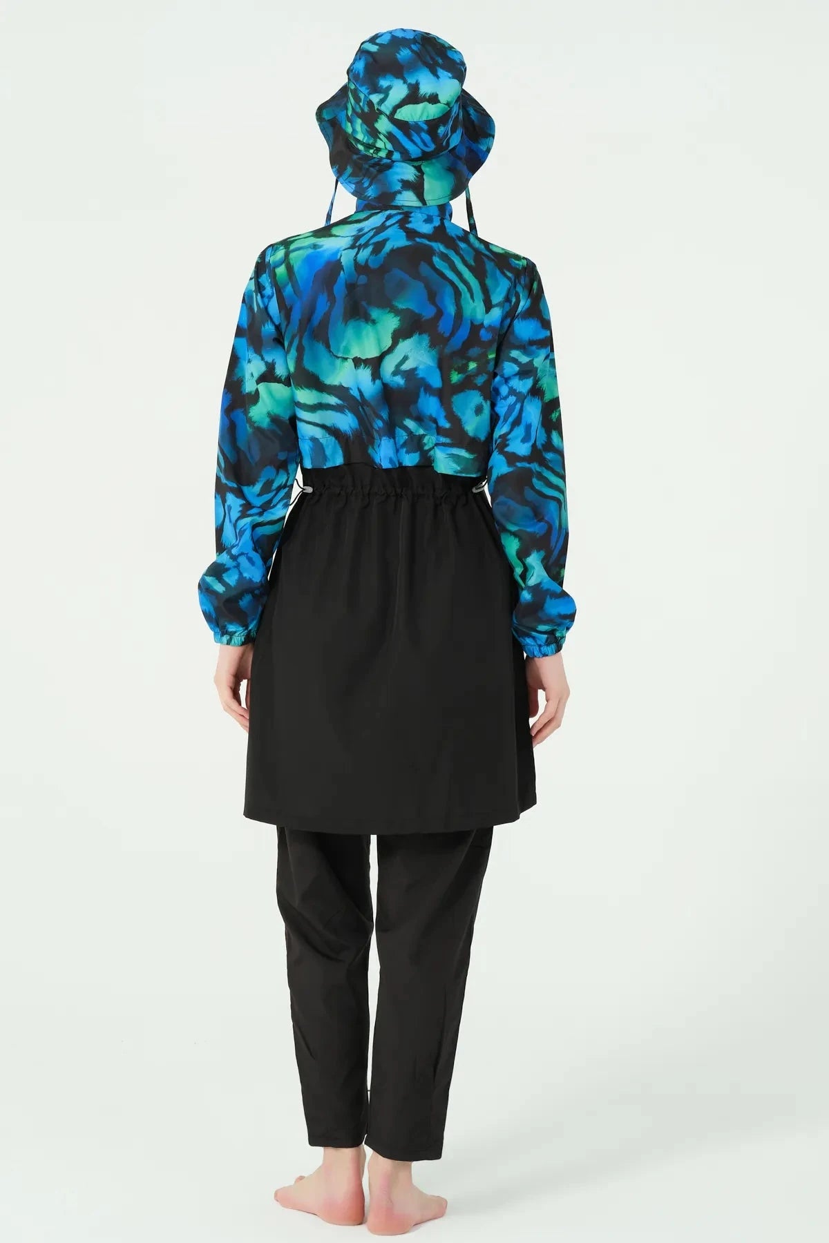 Back view of ocean-inspired print burkini set with black tunic.