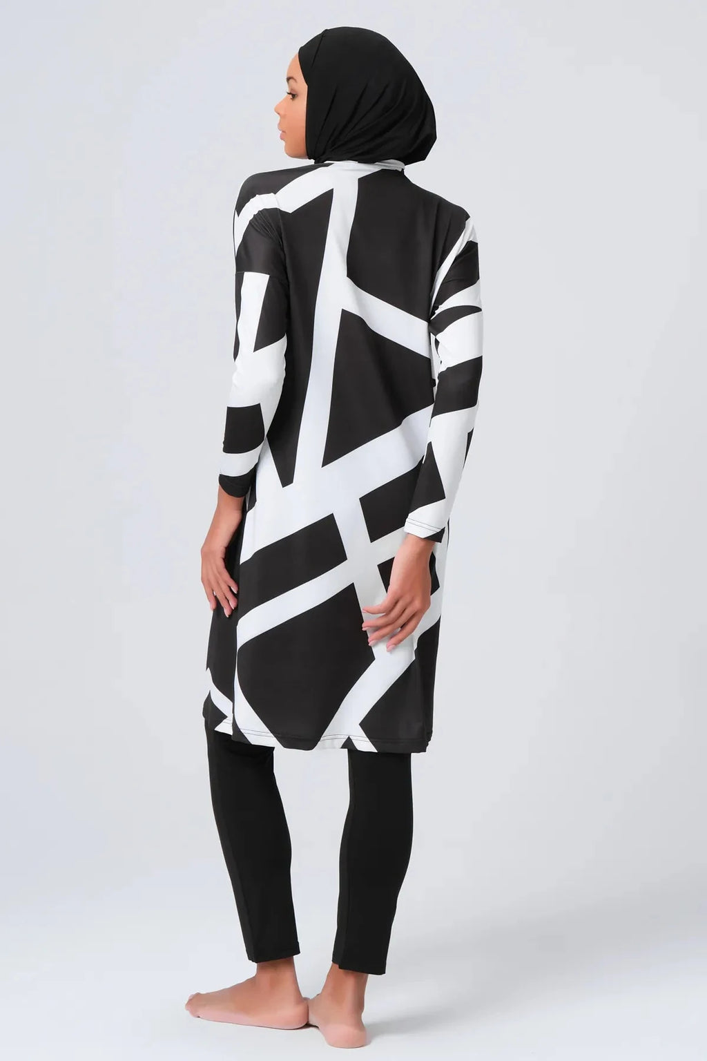 Black and white geometric print burkini set with hijab, back view.