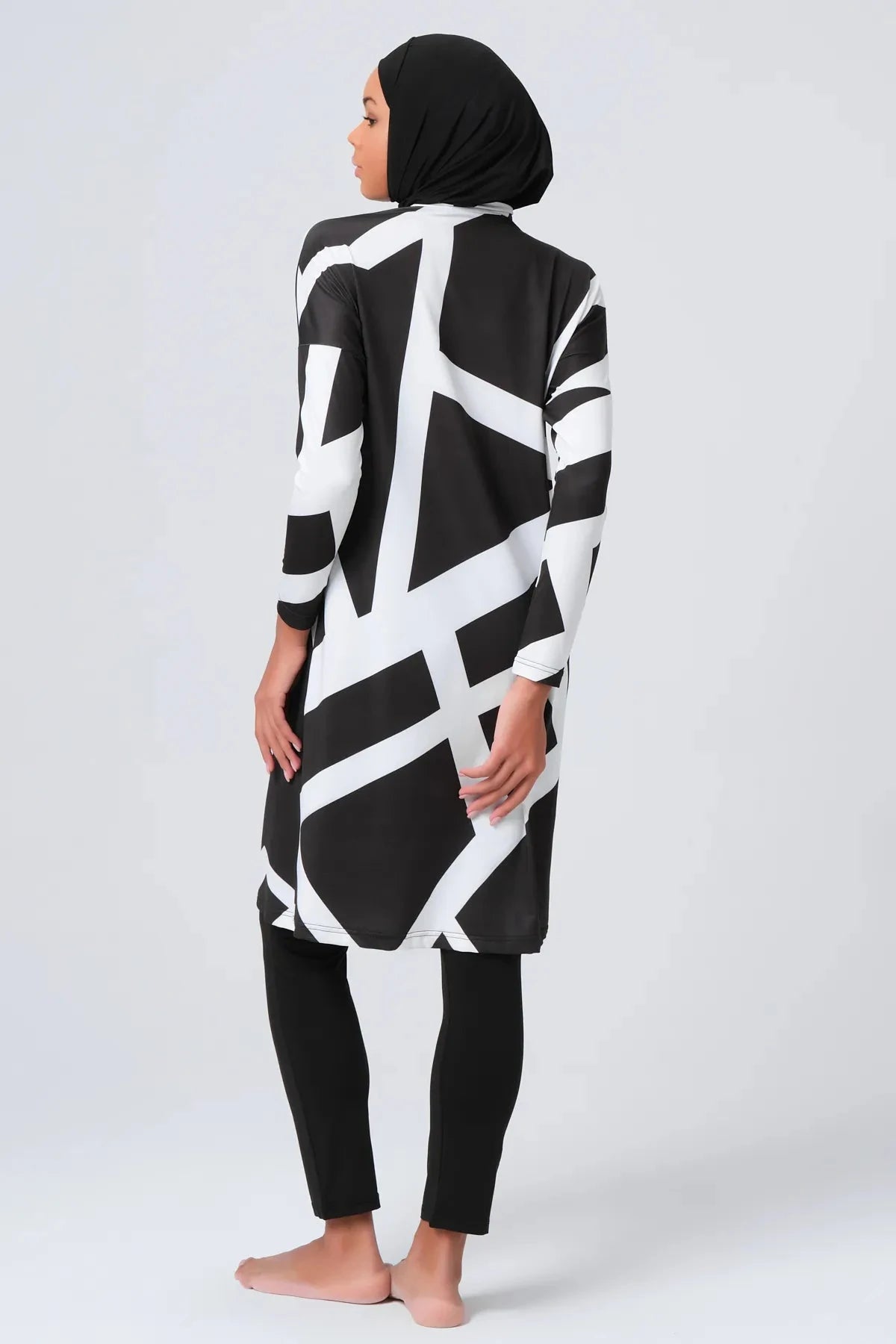 Black and white geometric print burkini set with hijab, back view.