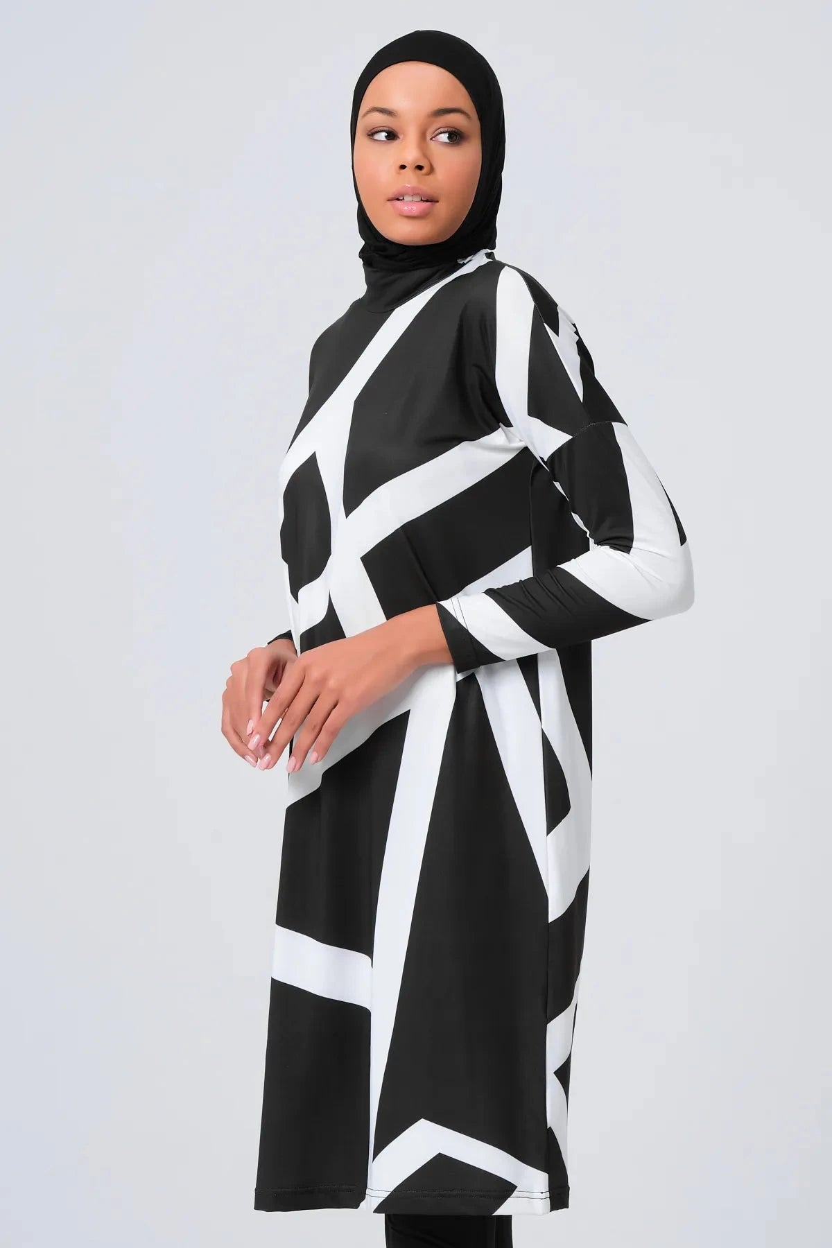 Black and white geometric print burkini set with hijab, side view.