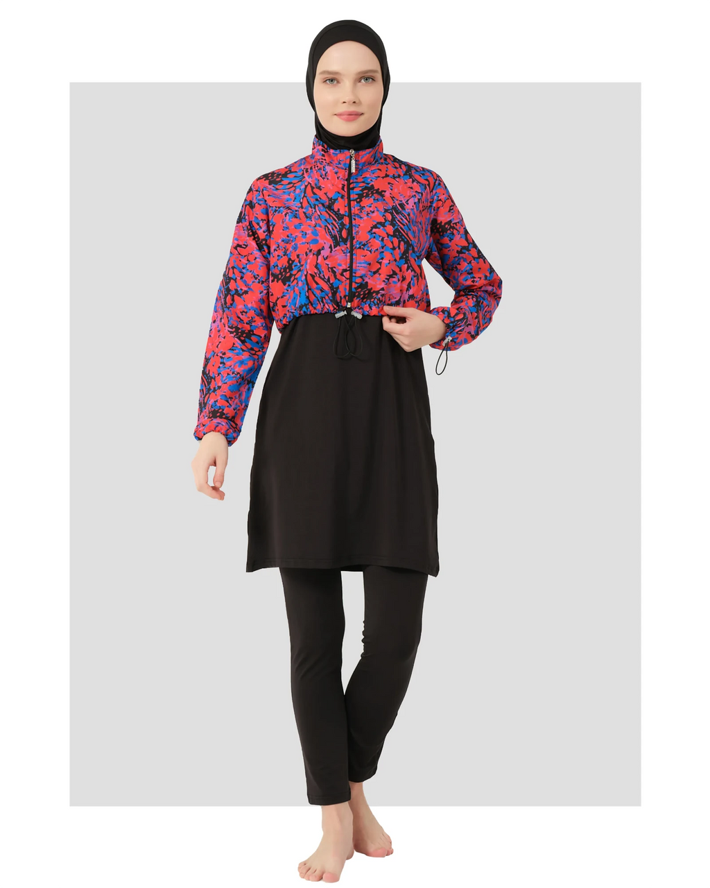 Woman in black hijab swimwear with abstract print jacket, front view.