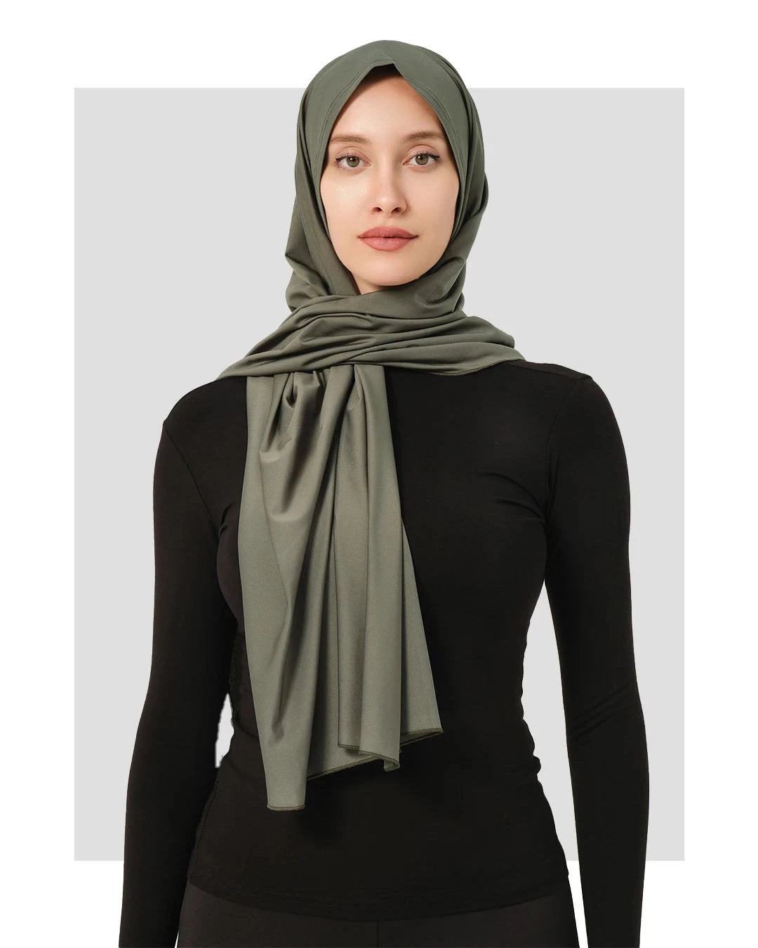 Olive green swim hijab with secure fit, worn over black long-sleeve top.