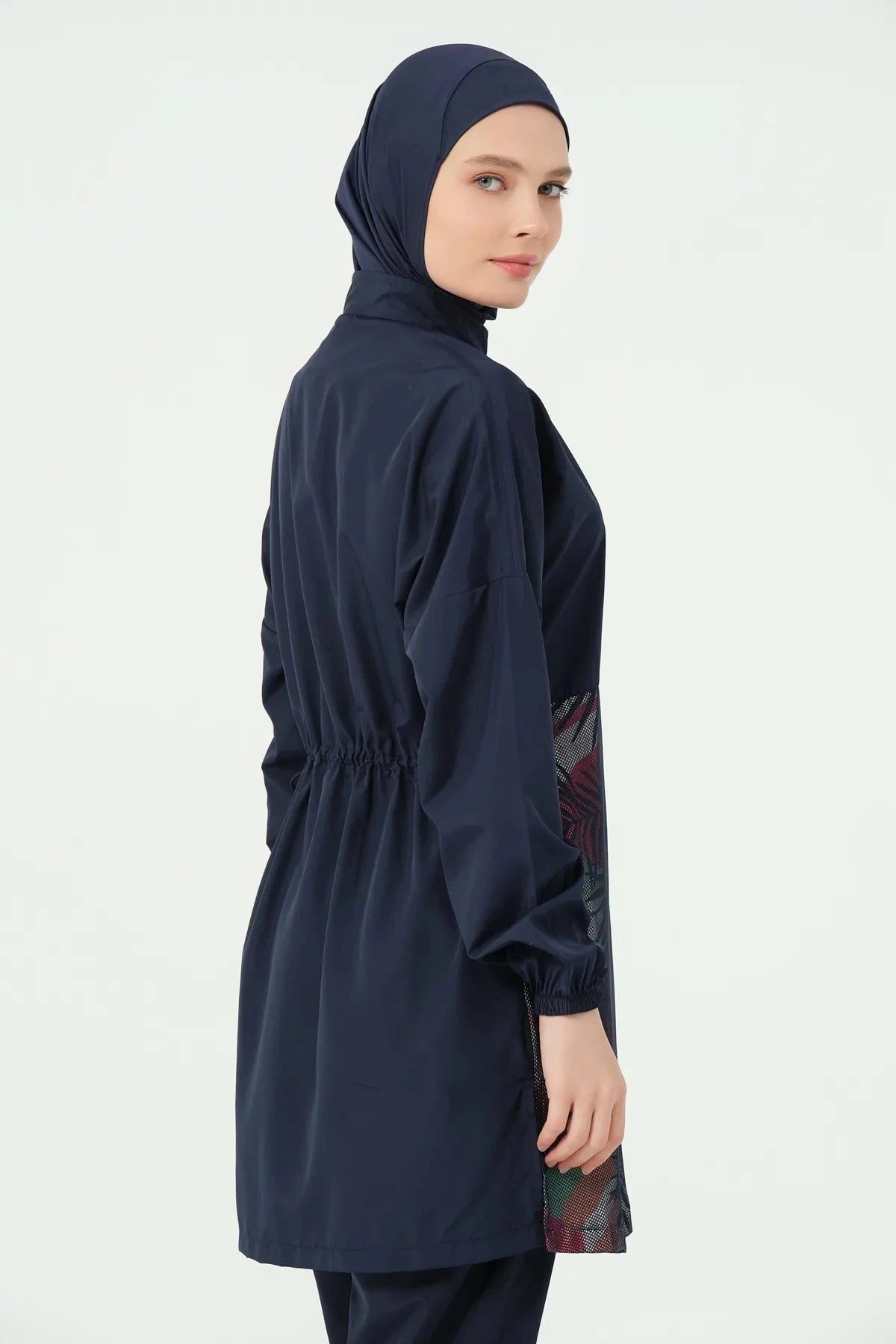 Navy burkini set side profile close-up, model looking at camera.