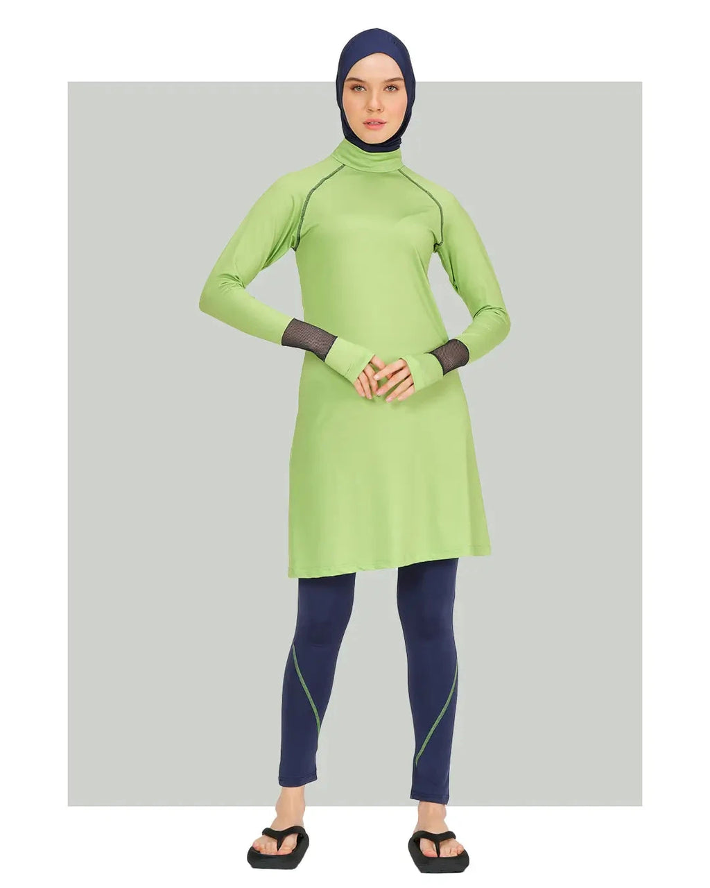 Model in lime green and navy hijab swimwear set, front view.