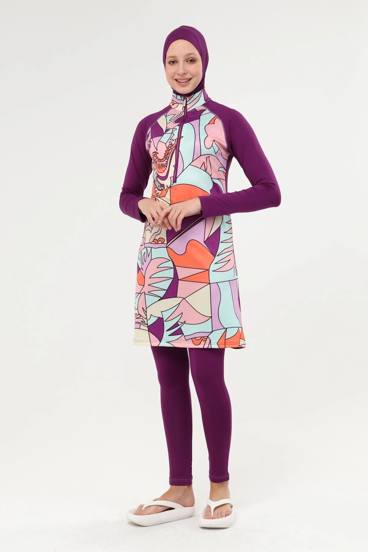 Full coverage modest swimsuit in eggplant purple with abstract pattern.