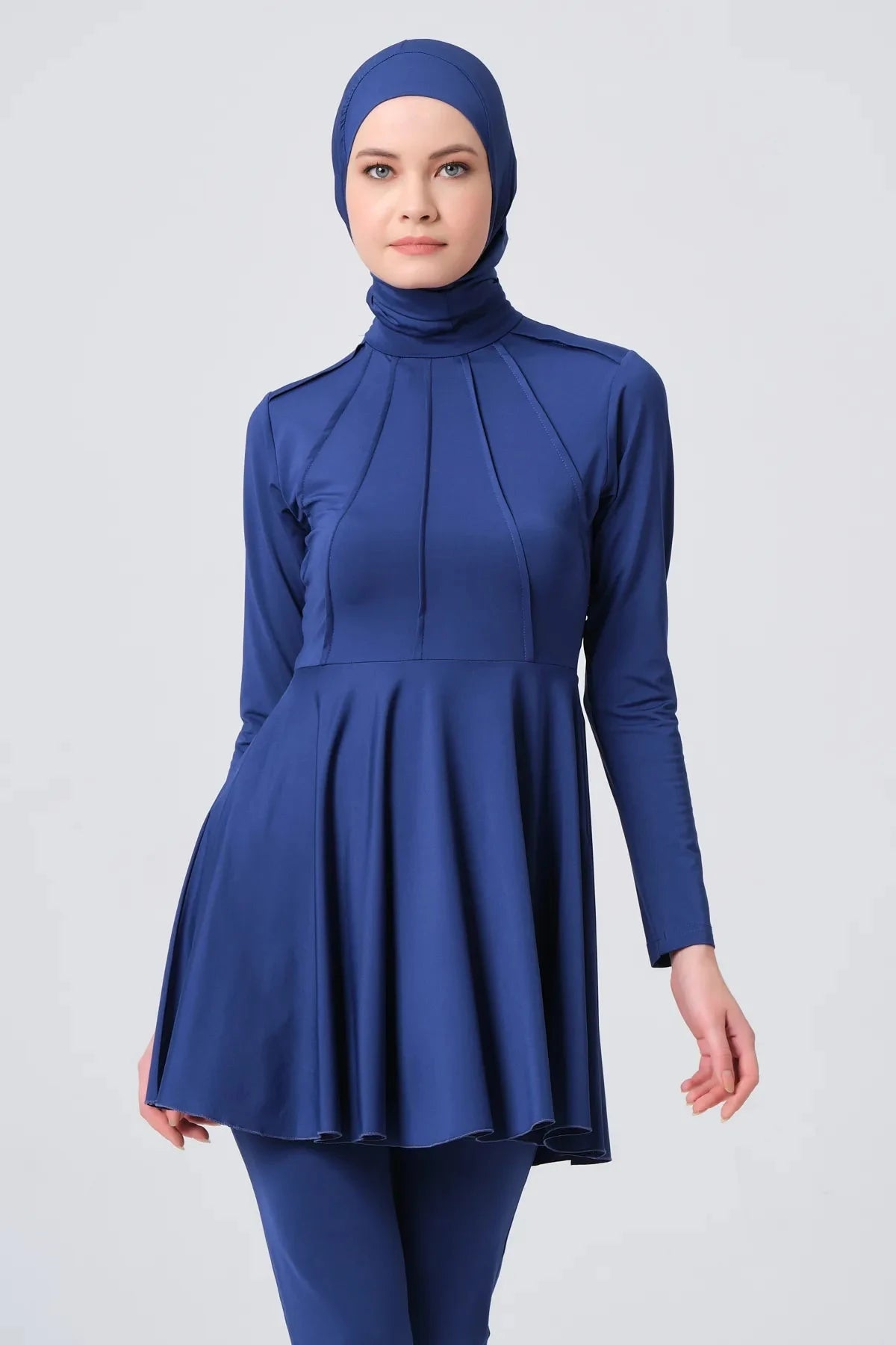 Close-up of dark blue modest swimwear top with high neck.