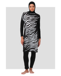 Woman wearing black and white zebra print burkini front view.