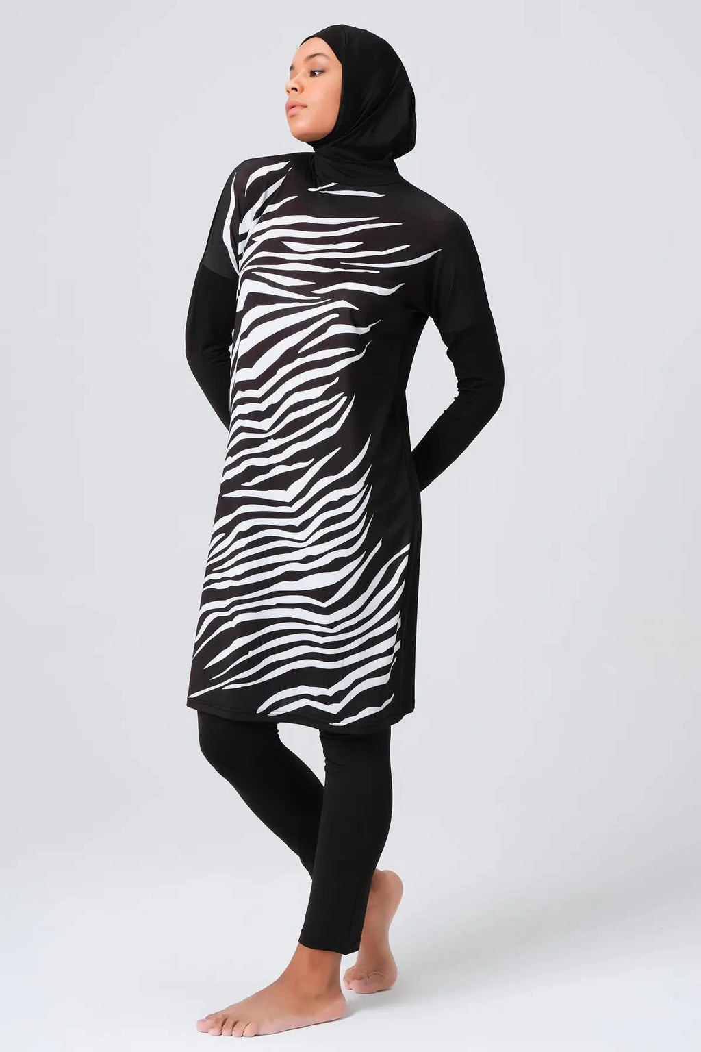 Modest swimwear set with zebra print tunic side profile.