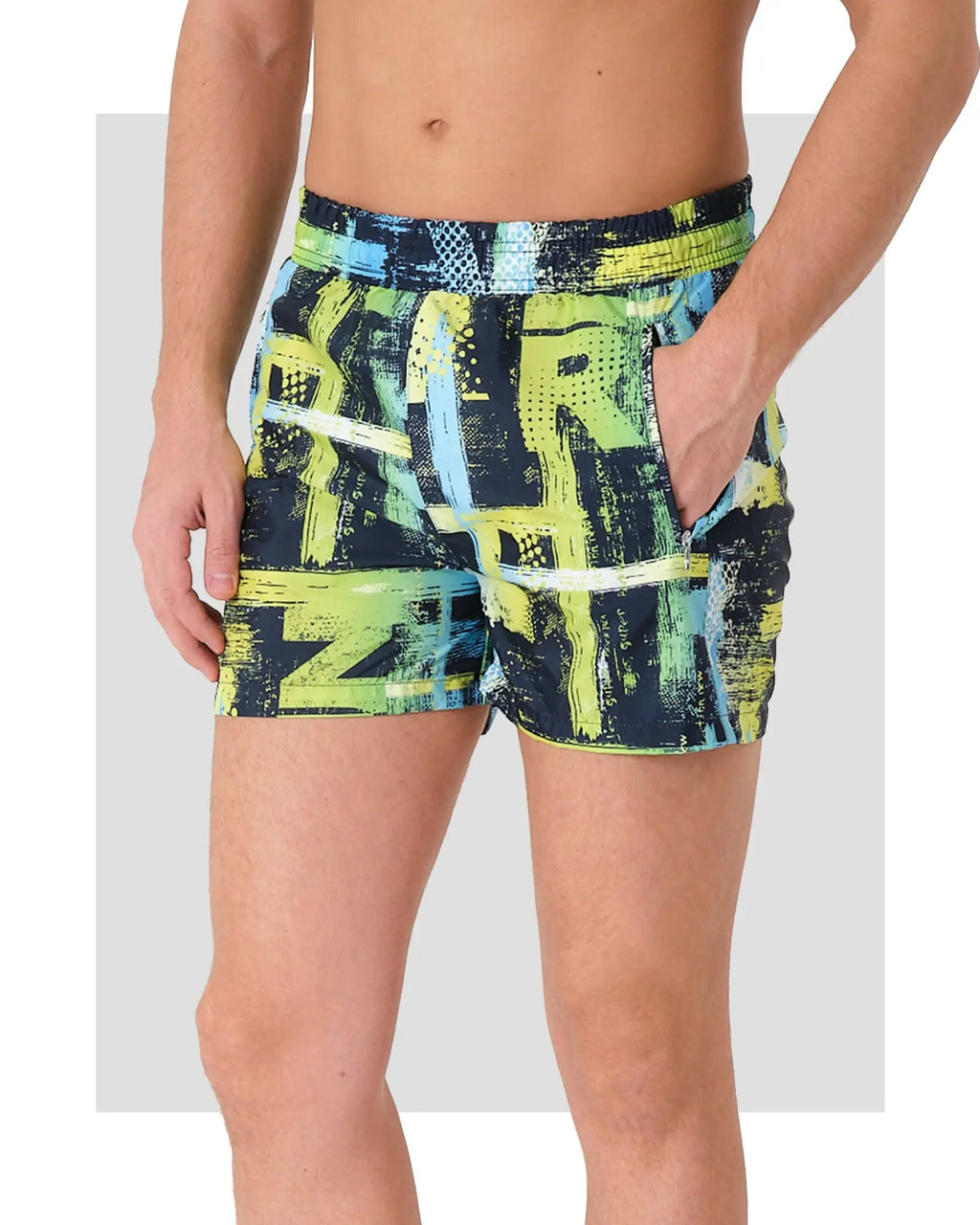 Men's neon abstract print swim trunks, side view with hand in pocket.