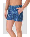 Blue men's swim trunks with surfing and palm print, side view showing zipper pocket.