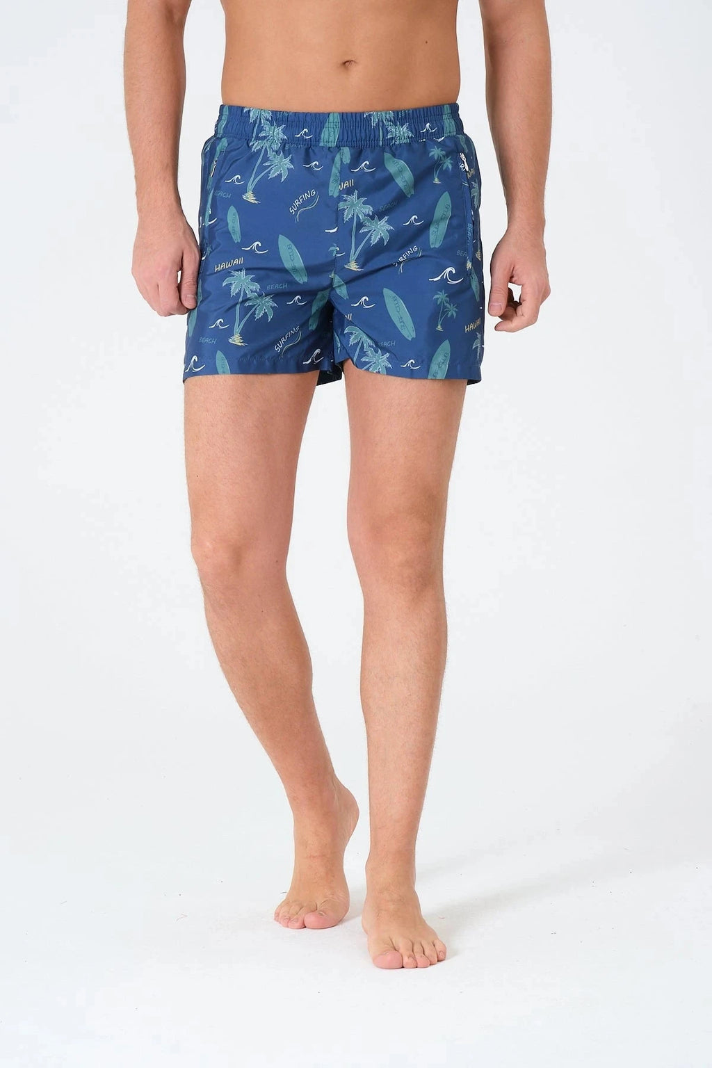 Blue men's swim trunks with surfing and palm print, front view.