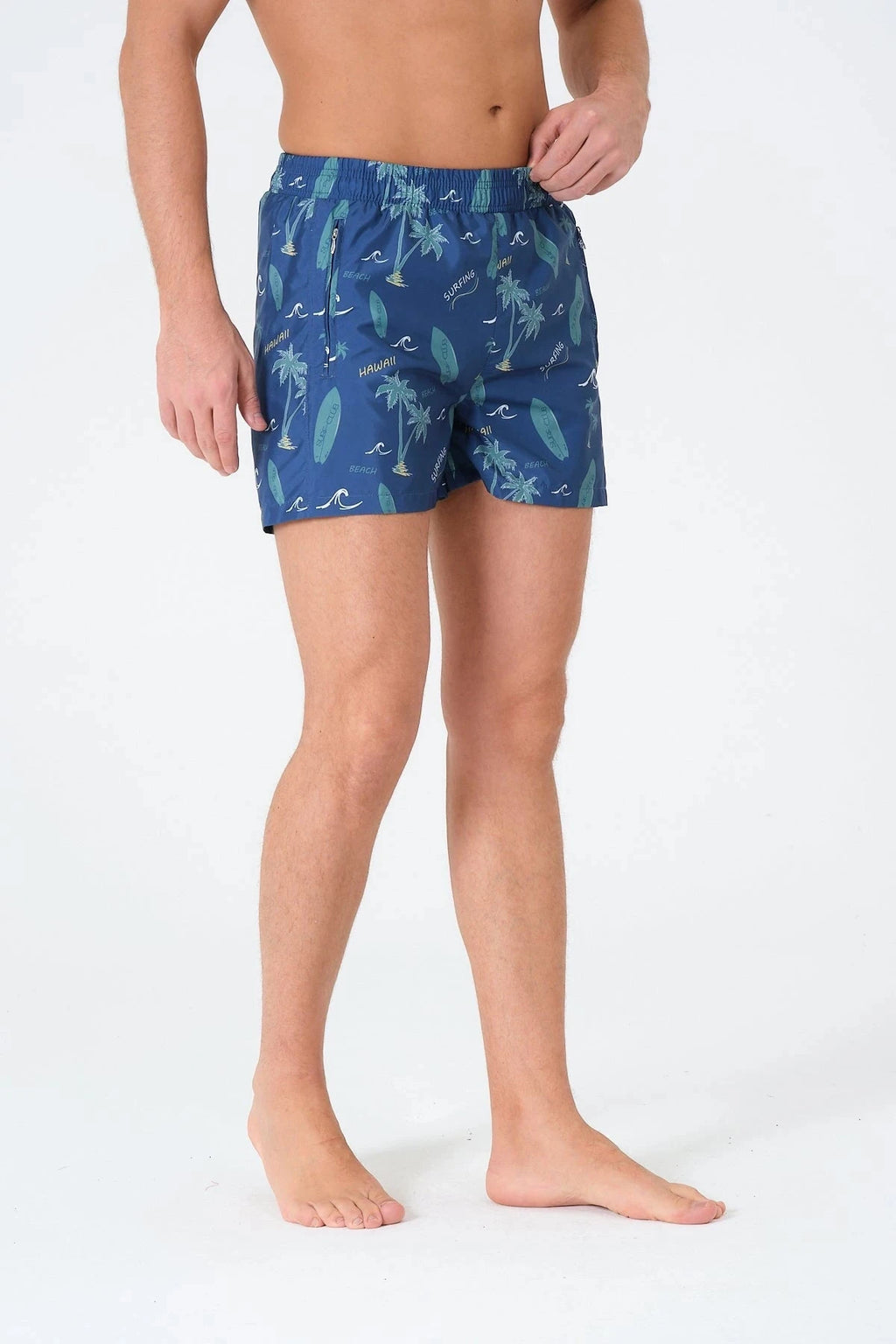 Blue men's swim trunks with surfing and palm print, side view.