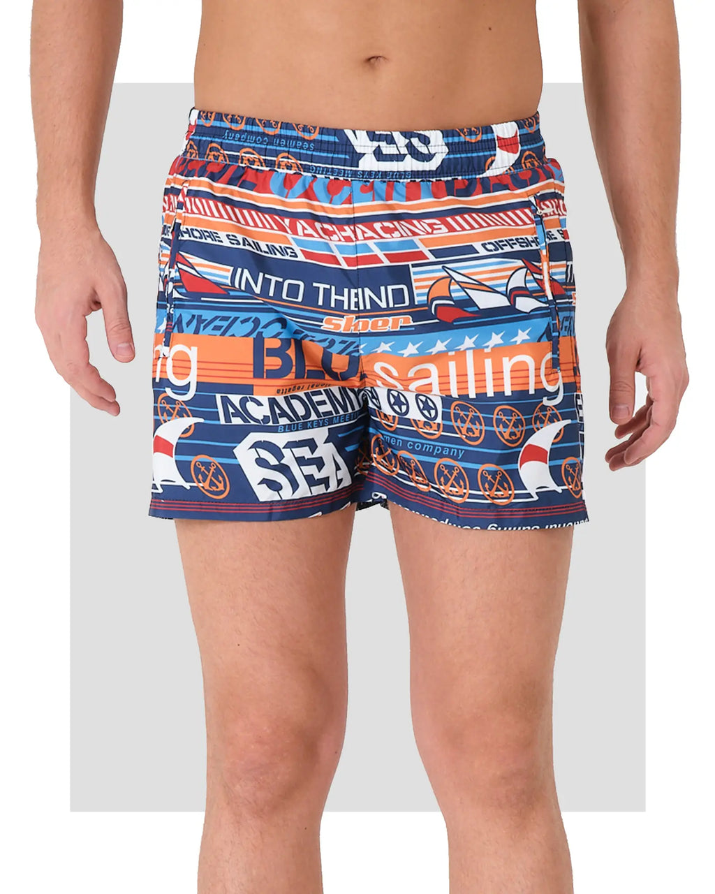 Men's swim trunks with sailing print, front view on white background.