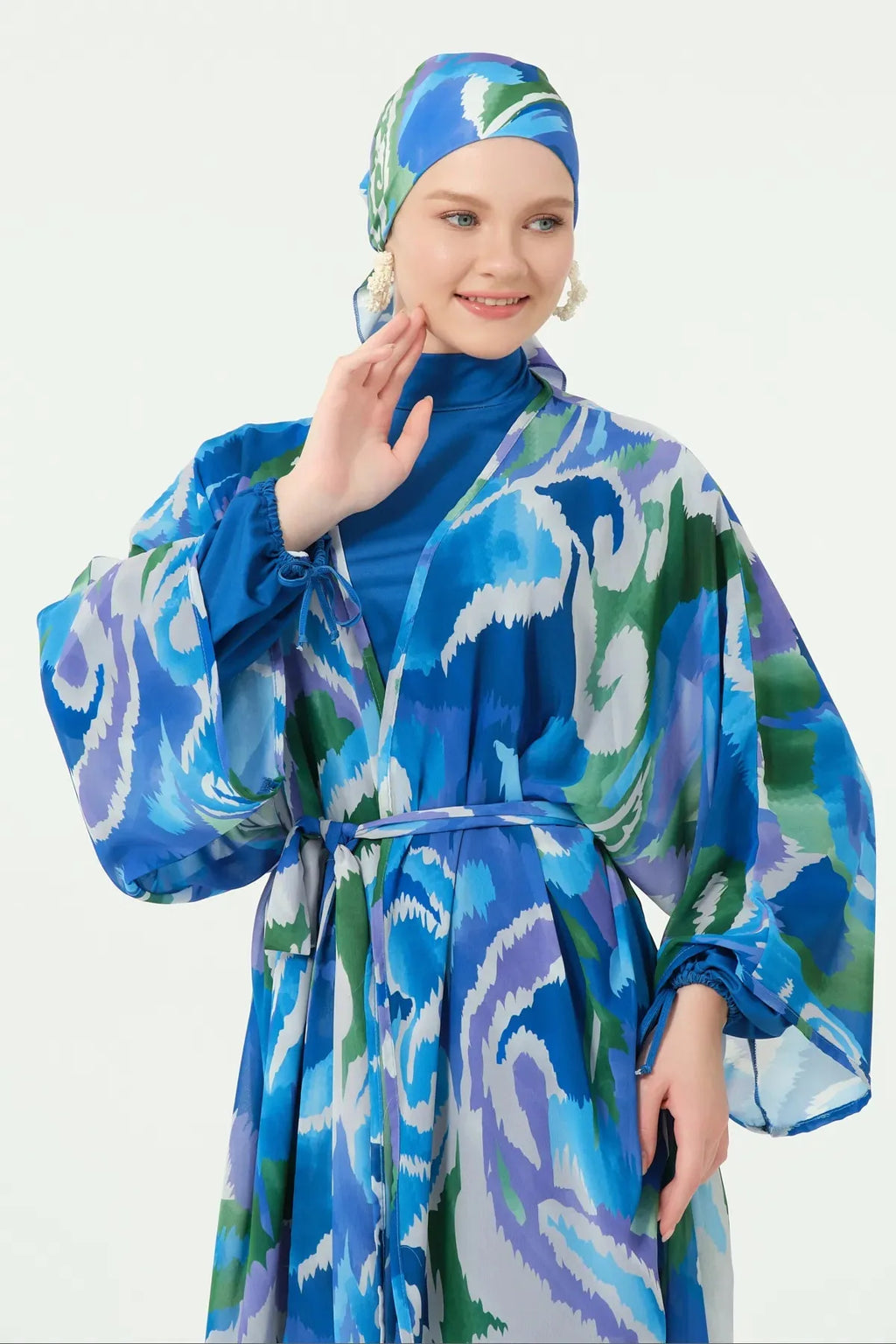 Close-up of model in deep azure sheer kimono with abstract print.