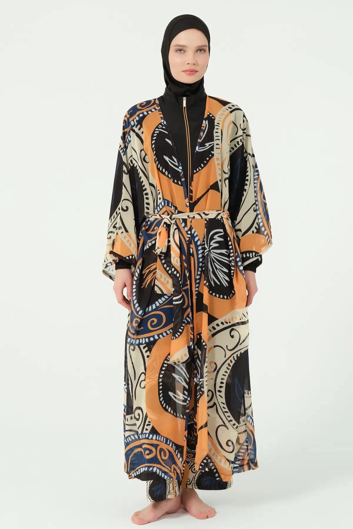 Model wearing abstract print sheer kimono with tie belt, front view.