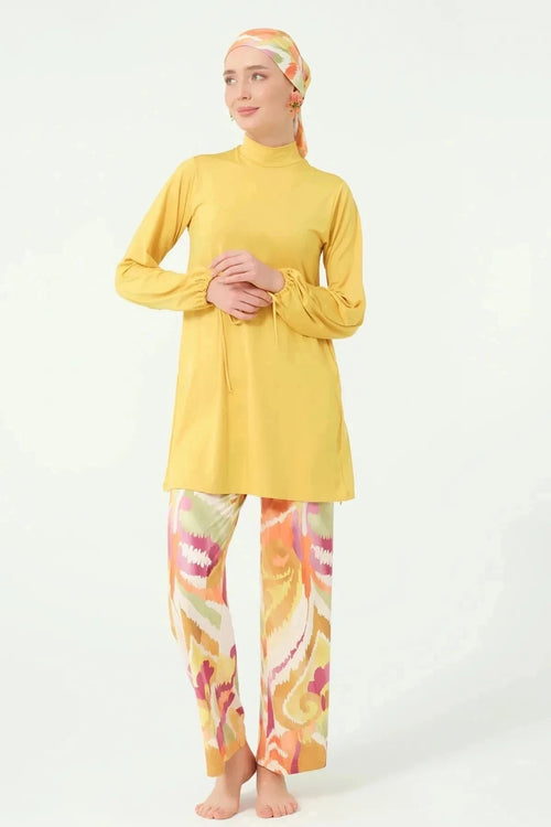 Full view of woman in golden yellow modest swimwear set