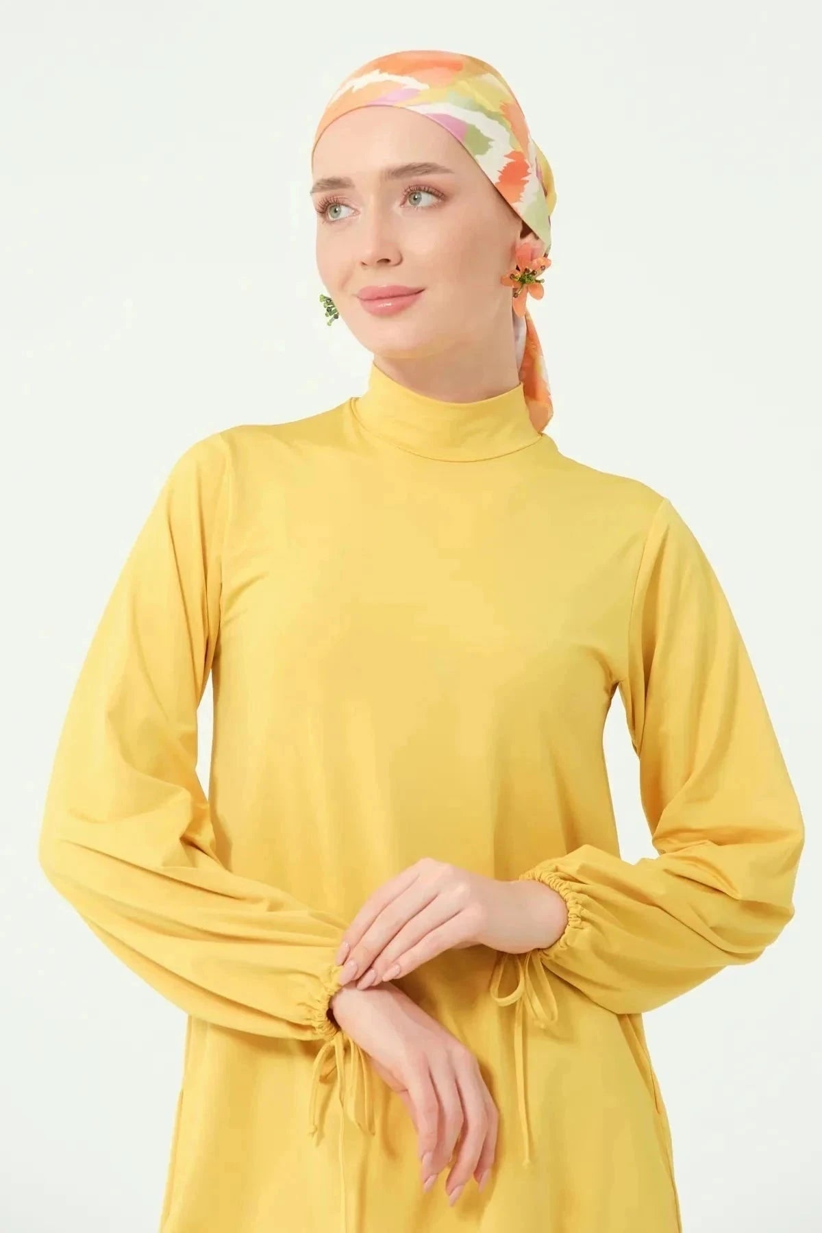 Upper body view of golden yellow modest swimwear set