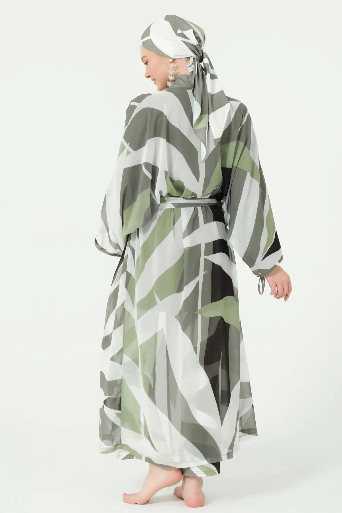Back view of model wearing geometric print kimono and matching hijab.