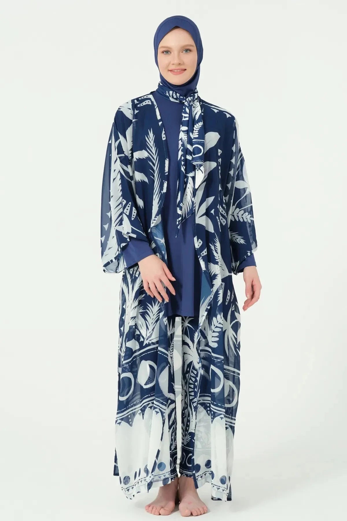 Woman in navy print kimono open over matching swimsuit, front view.