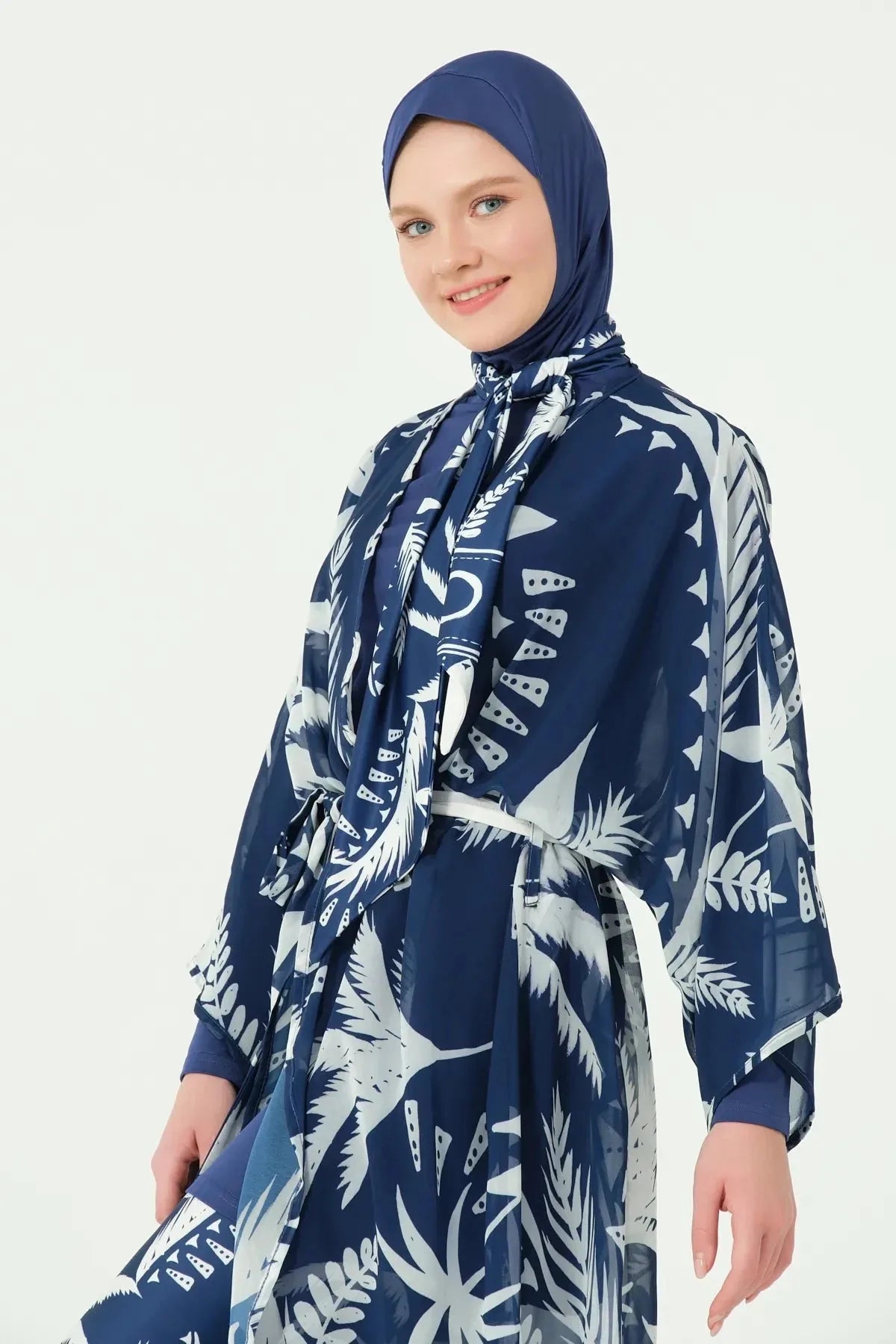 Close-up of woman in navy print kimono, showing pattern and belt detail.