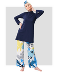 Model in navy modest swimwear set with abstract print pants, front view.