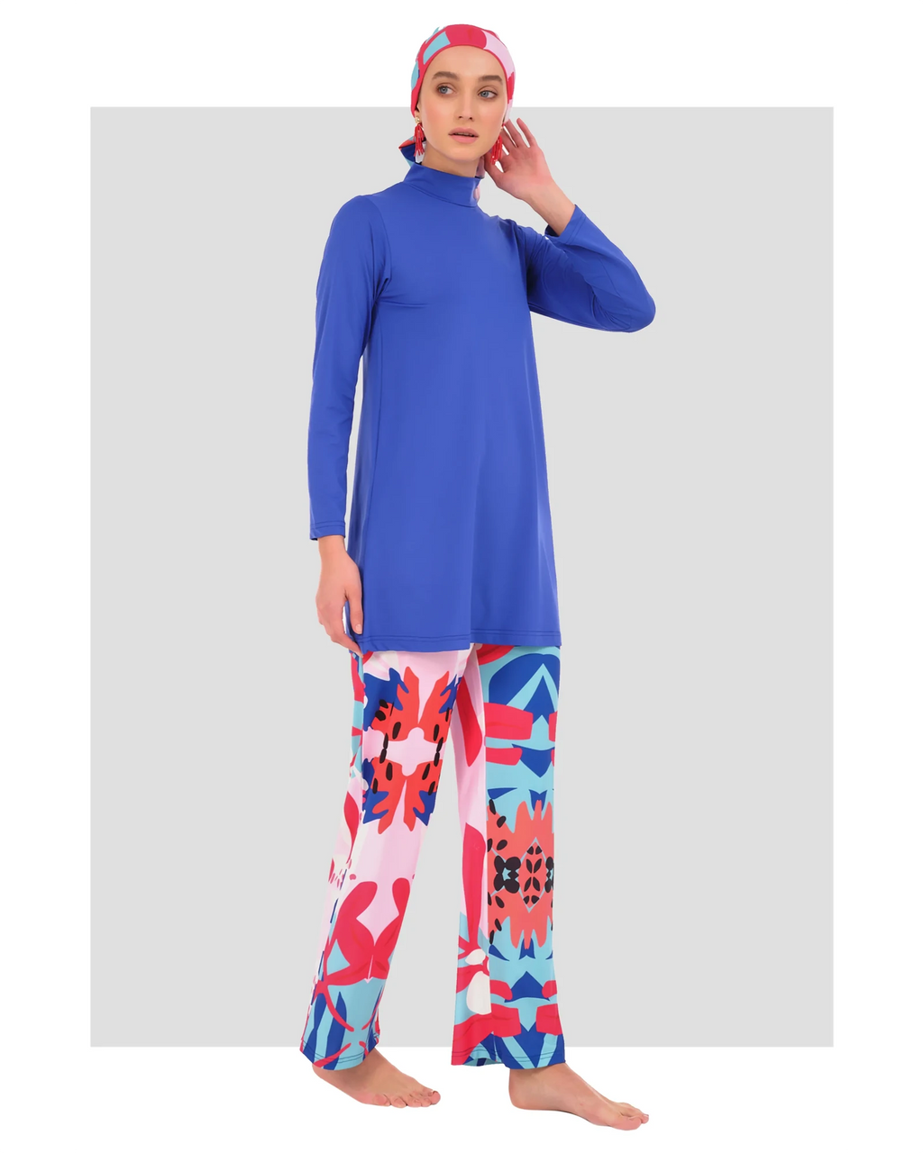 Royal blue modest swimwear set with patterned pants, side view.