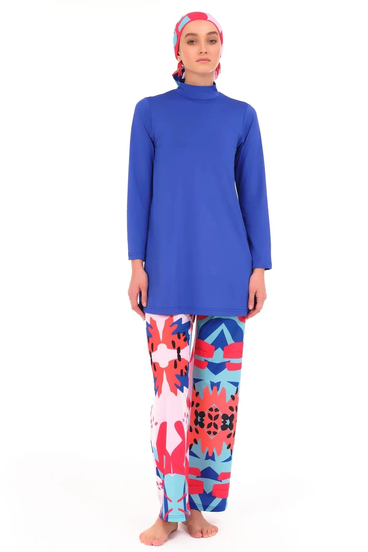 Royal blue modest swimwear set with patterned pants, front view.
