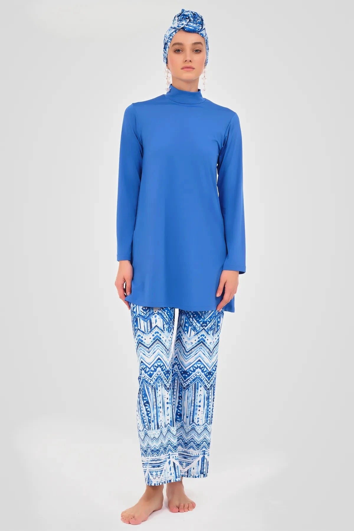 Model in cobalt blue modest swimwear set, full front view, standing.