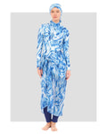 Woman in indigo ocean wave print modest sarong and swimwear set front view