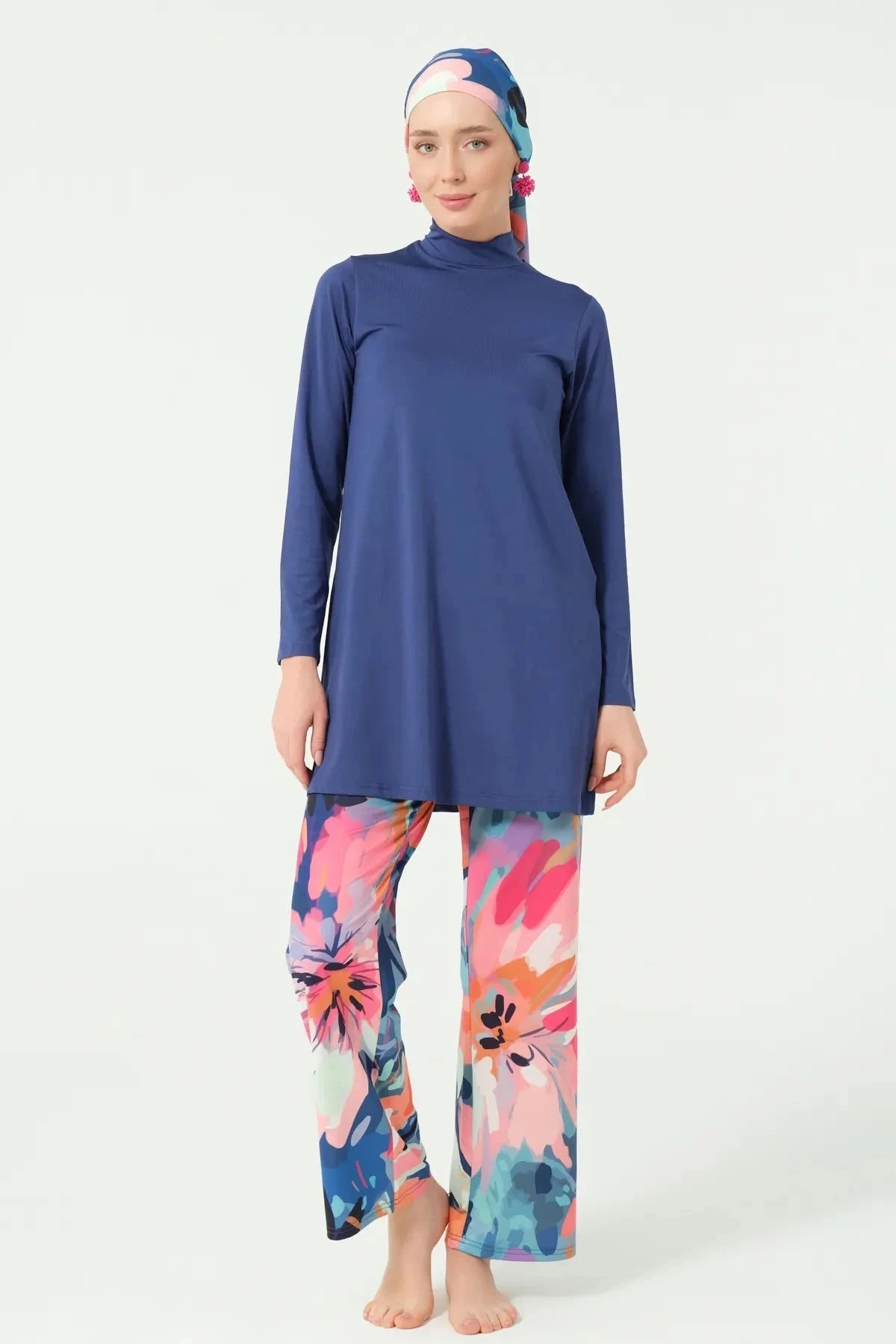 Full front view of woman in indigo floral modest swimwear set.