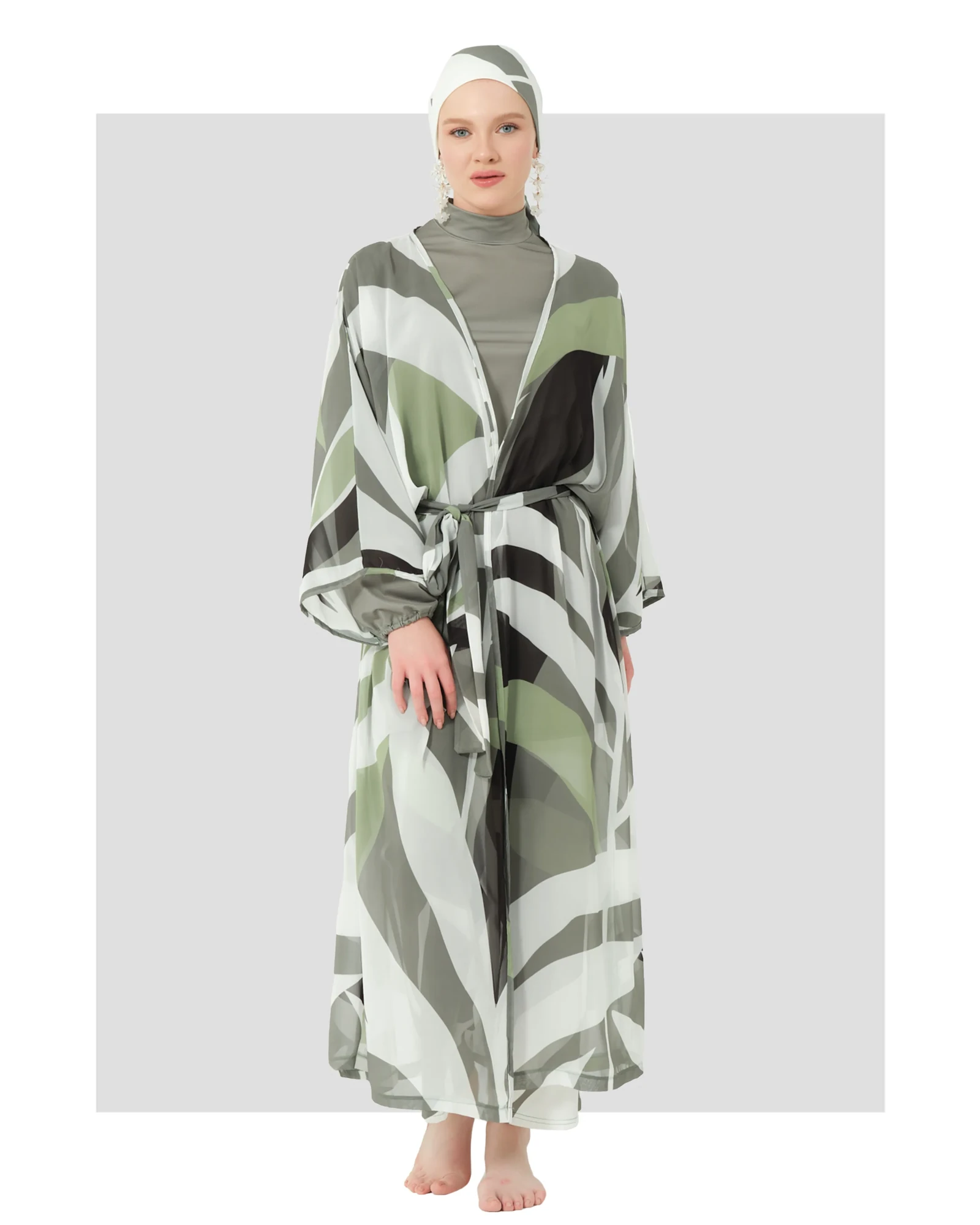 Model wearing tropical print kimono burkini with sheer overlay, front view.