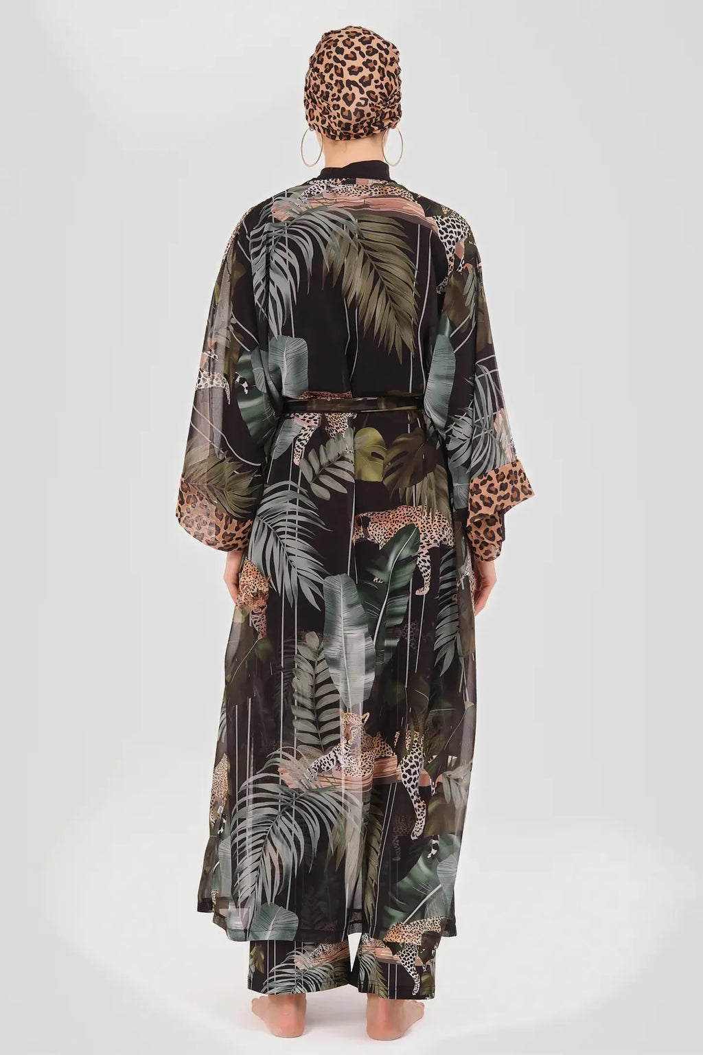 Sheer kimono with leopard and tropical print, back view on model.