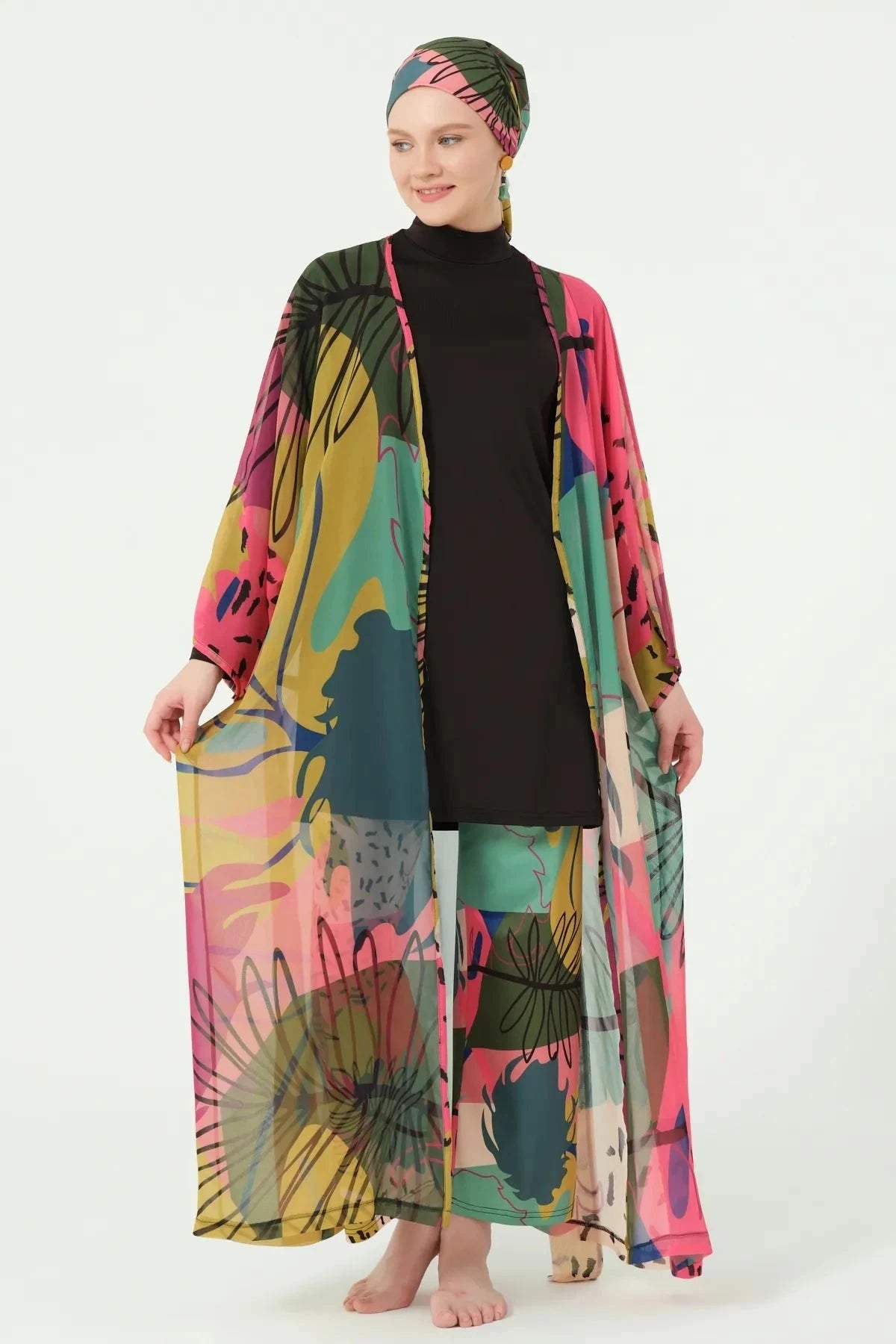 Multi-color sheer kimono cover-up worn open over black swimwear.